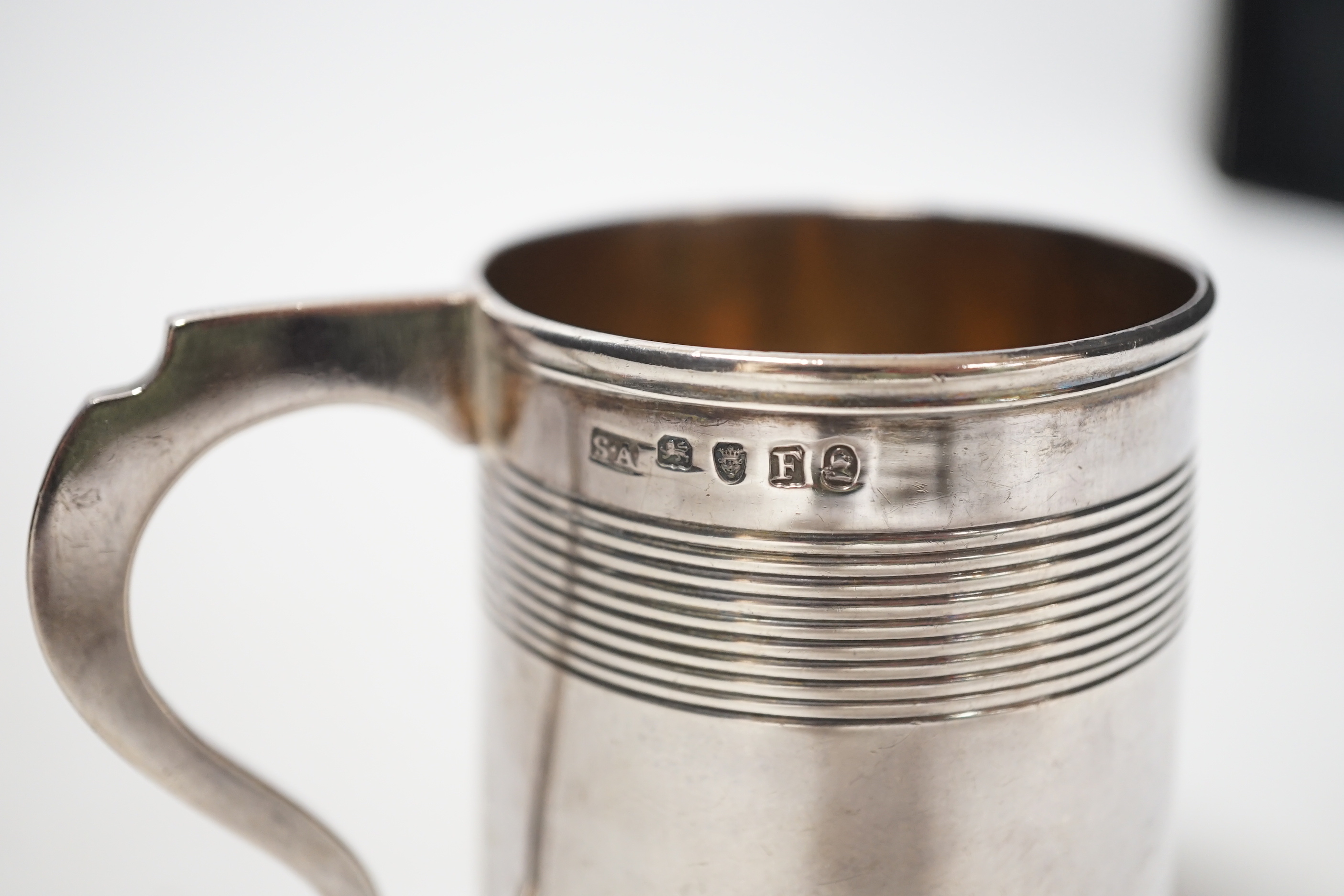 A George III reeded silver christening mug, Stephen Adam I, London, 1801, 85mm.